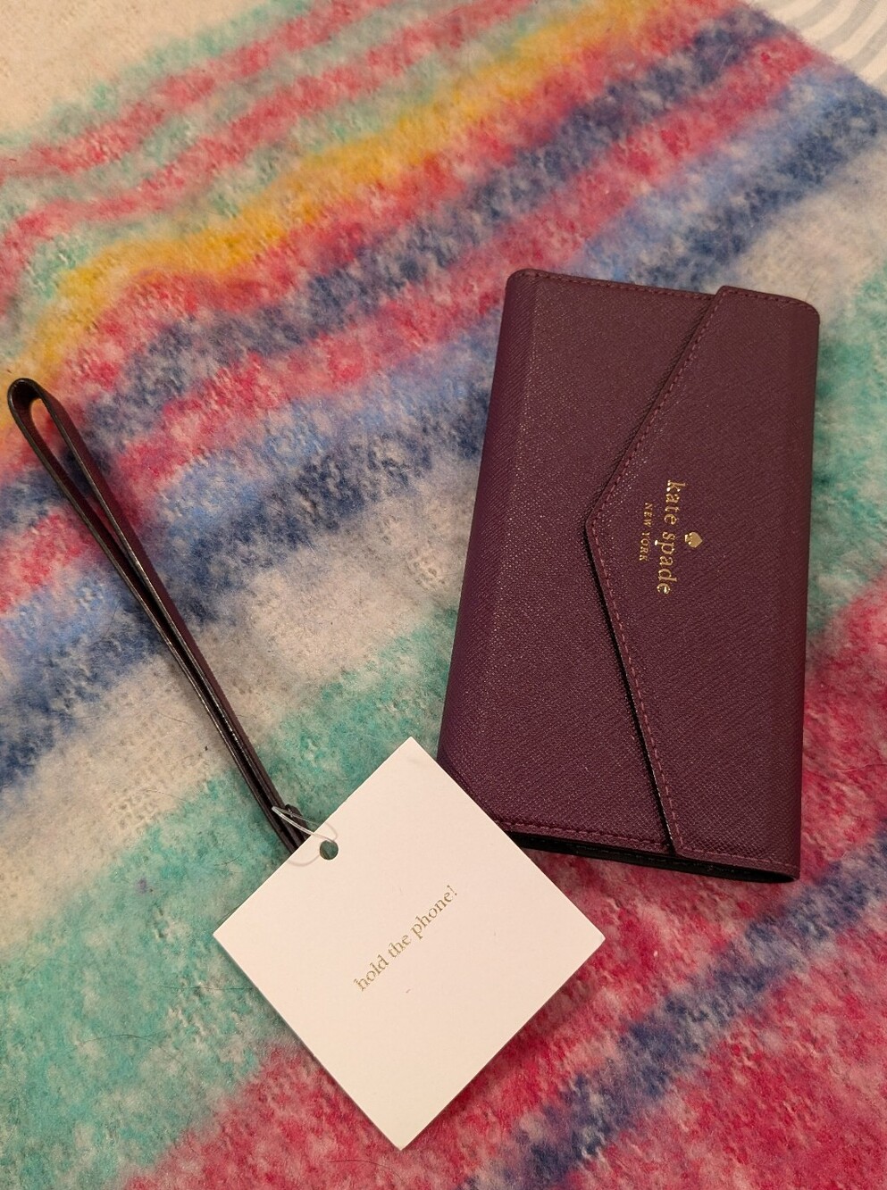 kate spade Plum Leather Wristlet Phone Case with Gold Logo
